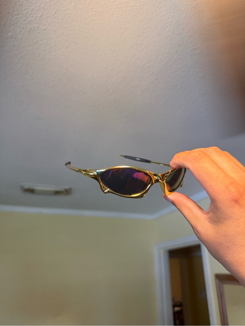 Gold Frame Sunglasses with Dark Lenses Oakley Oakleys